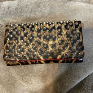 Preloved Christian Louboutin wristlet wallet in great condition . Authentic